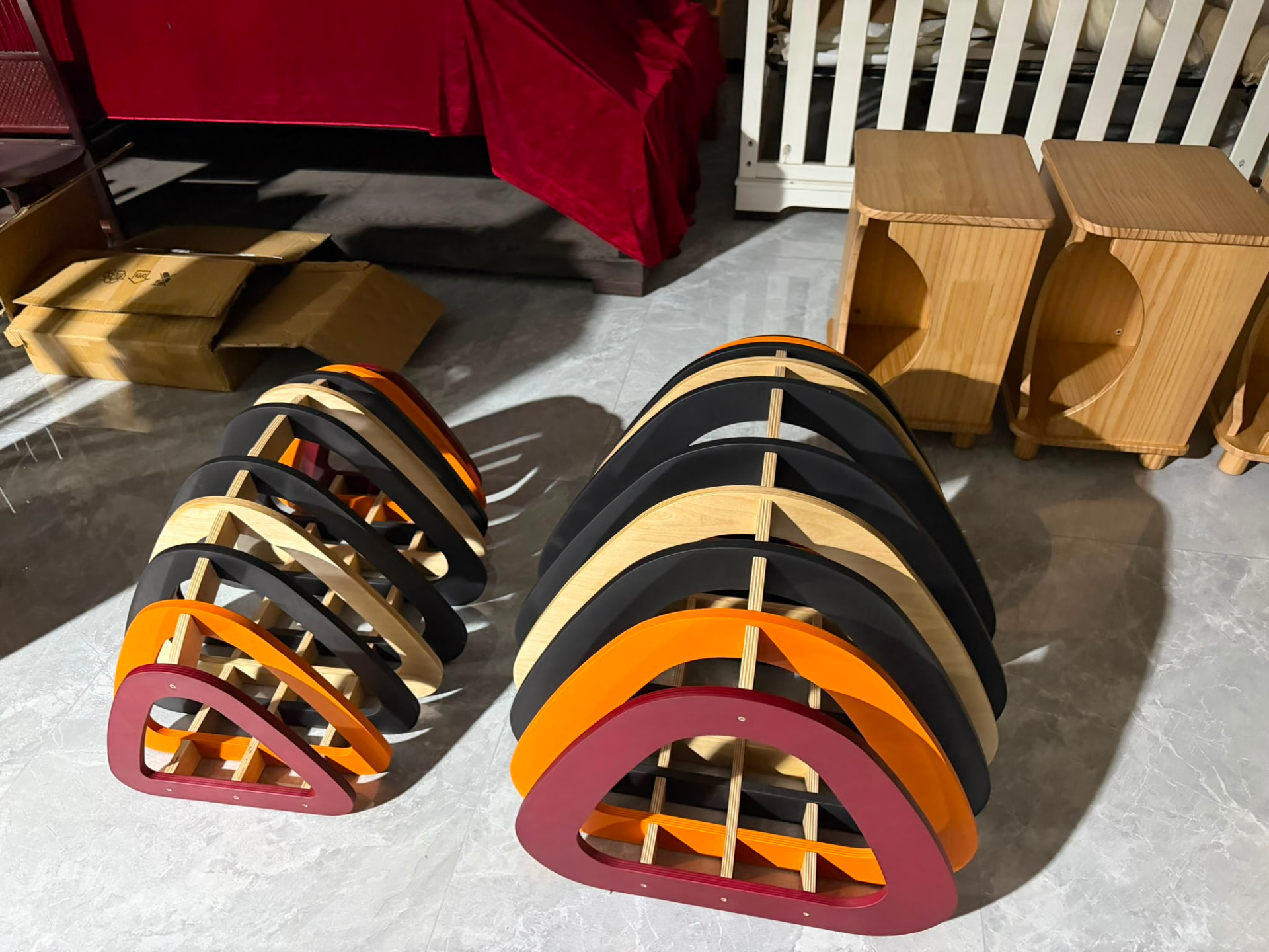 Curved wooden cat scratcher ramps in natural, black, orange and burgundy finishes